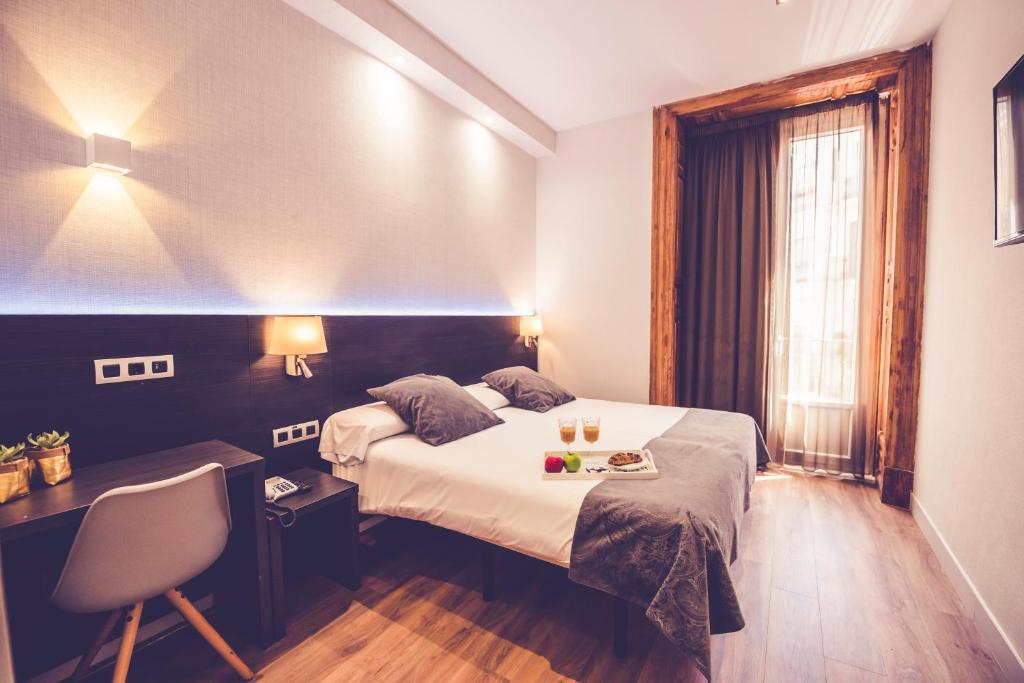 Spanish hotel room before photo enhancement